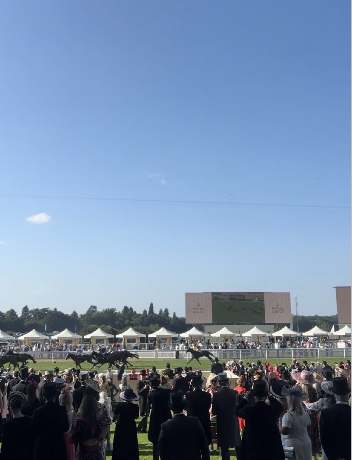 Race day at Royal Ascot. Top hats, fascinators and elegant dresses in the crowd